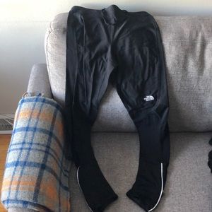 The NorthFace Track pants zip size small.